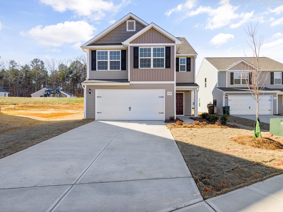 Residential driveway surface leading to a garage